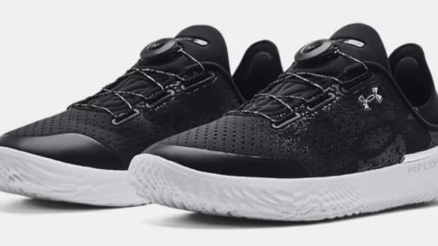 View of black and white Under Armour shoes.